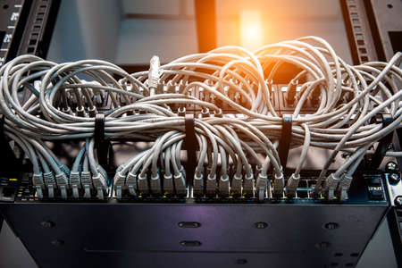 A lot of network cables connected in a big network switchの写真素材