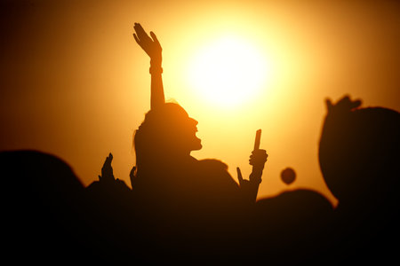 Silhouette of people on a big festival eventの写真素材
