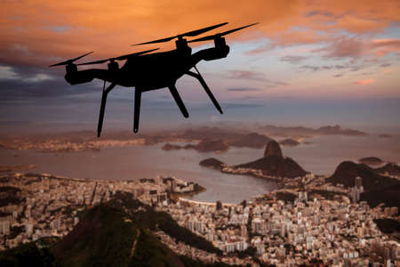 Drone silhouette flying above Rio de Janeiro cityの写真素材