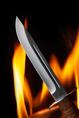 Knife on the fire background