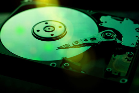 Close up of hardisk internal mechanism hardware.