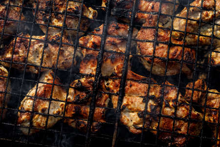 Meat is fried on the grill. The wire rack with roasted porkの写真素材