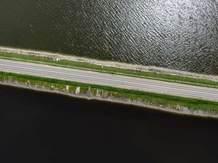The road on the natural bridge. Top view of damの写真素材