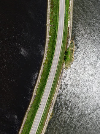 The road on the natural bridge. Top view of damの写真素材