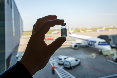 Warsaw, Poland - July 06, 2021. Sinopharm vaccine at the airport. Travel without limits concept.のeditorial素材