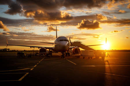 Commercial airplane in an airport before people boardingの写真素材