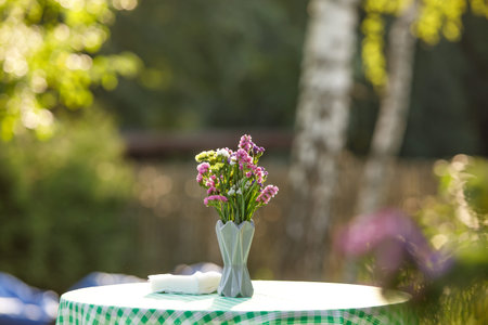 Wildflowers in a small vase in the village garden