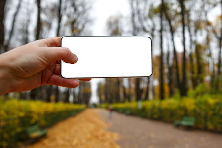 Using smartphone outdoor mockup - Empty white black screenの写真素材
