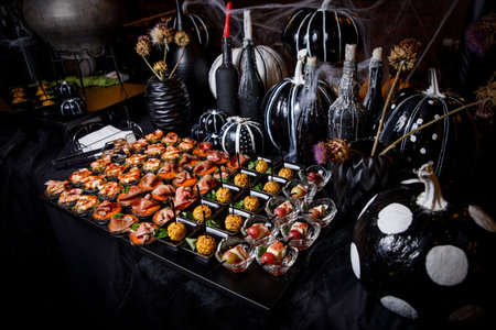 Banquet service. catering food, snacks with cheese, jamon, prosciutto and fruitの写真素材