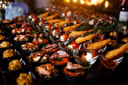 Banquet service. catering food, snacks with cheese, jamon, prosciutto and fruit