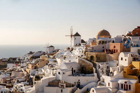 Panoramic iconic view from Oia village with Windmill on Santorini island, Greece. The place for text includedの写真素材