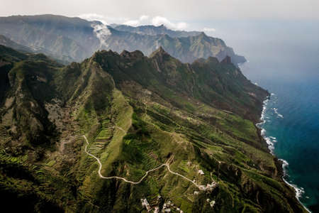 Aerial drone view of green mountains on Anaga Rural Park, Rocky shore of Tenerife, Spain.の写真素材