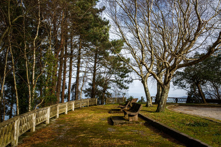 The stone benches are on a beautiful viewpoint in Spain. Mirador in the Basque country near Bilbaoの写真素材