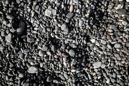 Smooth round pebbles texture background. Pebble sea beach close-upの写真素材