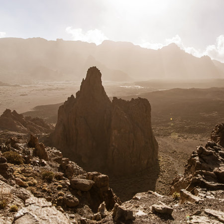 Volcanic rocks valley in Teide park on Tenerife.Orange haze over the mountains