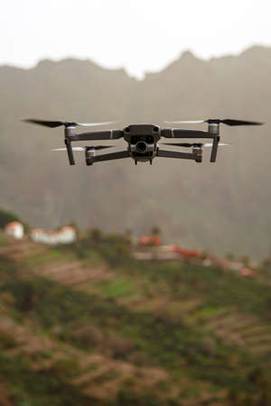Drone flies and taking photos and videos in the mountainsの写真素材