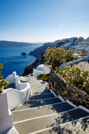 Santorini, Greece. Picturesque view of traditional Cycladic Santorini houses on small streets and...