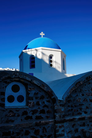 The blue dome of Greek orthodox church on Santorini islandの写真素材