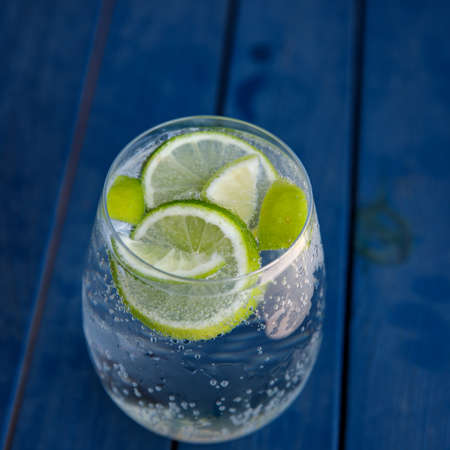 Top view of glass with cold drink with limeの写真素材