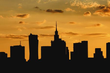 Big city skyline of Warsaw, Poland. Silhouettes Of modern skyscrapers and the famous Palace of Science and Cultureの写真素材