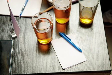 The pub quiz concept. Beer glass and blank paper for answersの写真素材