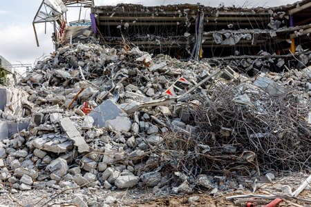 Destroyed building. Ruins of concrete and metal.の写真素材