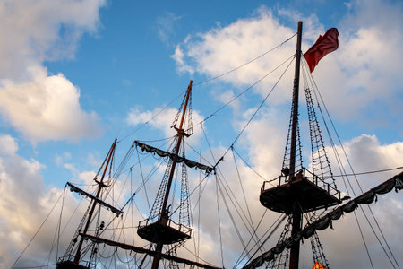 Masts and rigging of sail vessel on a sky background