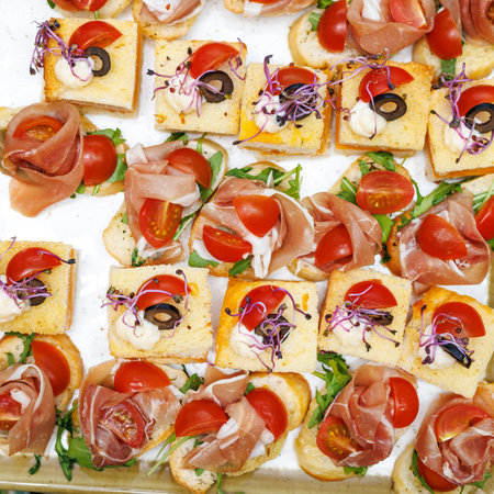 Top view of small sandwiches at an event catering, hotel buffet