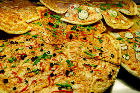 Slices of Italian pizza on the counter of a cafeの写真素材