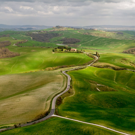Italian countryside scenery featuring a hilltop residence in Tuscanyの写真素材