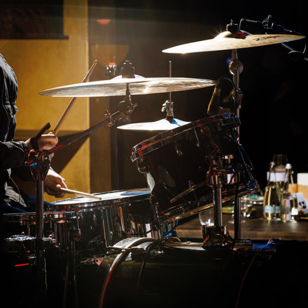 Close-up of drummer drumsticks with a drum setの写真素材