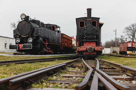 Classic steam engine at an open-air railway yard