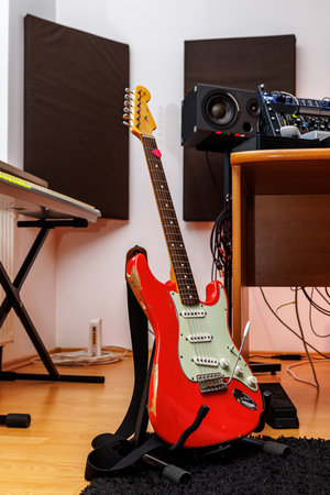 Home studio, Music Production studio with American vintage 62 Fiesta red guitarの写真素材