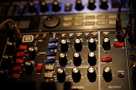 Sound equipment at a music studio. Sliders on a sound mixerの写真素材