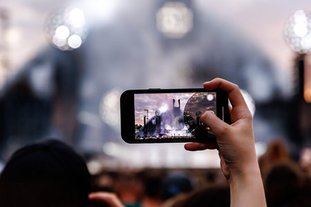 Smartphones in the Hands of the Crowd at an Outdoor Music Event