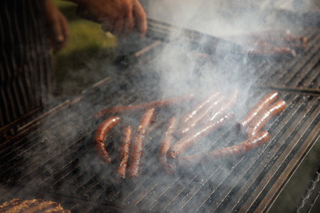 Sausages are fried on fire, bbq grill serviceの写真素材