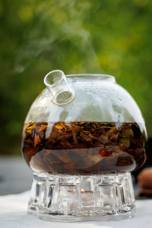 Tea is brewed in a glass teapot.の写真素材