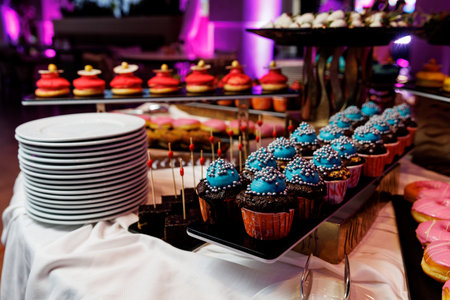 Chocolate cupcakes with toppings at the event tableの写真素材