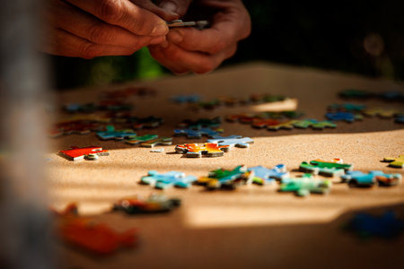 Elements of the puzzle are laid out on a table.の写真素材