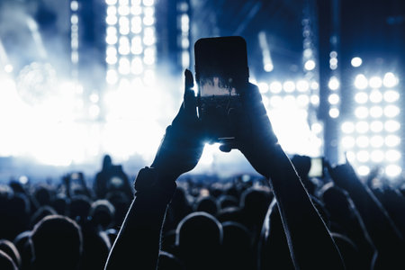 Taking a photo or video content at a music concert using a cell phone