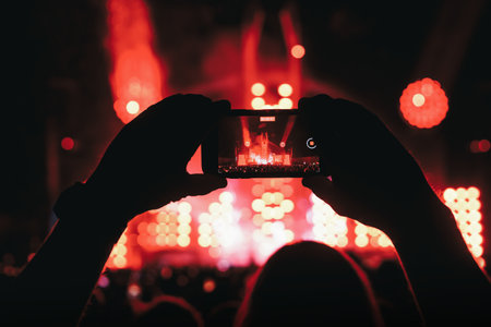 Streaming from the dance floor via mobile phone during a concert show.