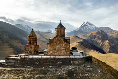 The church is on a cliff overlooking a valley