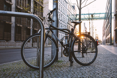 City bike parked on the street. Bicycles as a transport in townの写真素材