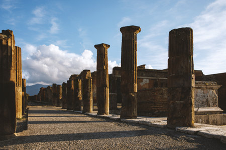 Columns of the ancient Roman city of Pompeii in Italy, sunset time