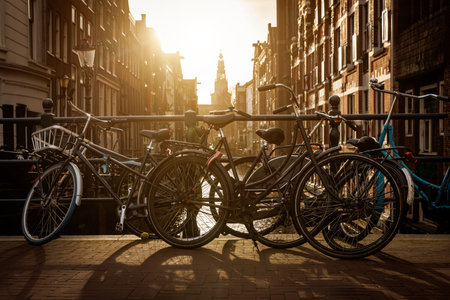 Bicycles parked on the bridge over the Amsterdam canal.の写真素材