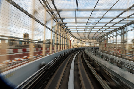 A dynamic and vivid view from a moving transit vehicle brilliantly capturing the essence of urban architectureの写真素材