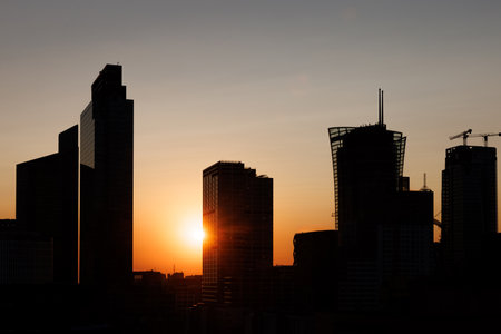 A breathtaking and stunning sunset silhouette showcasing a vibrant urban skyline viewの写真素材