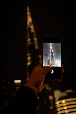 Taking photo of Burj Khalifa tower using a smartphoneの写真素材