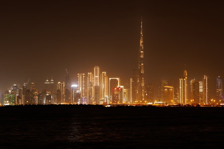 Panoramic view of a big futuristic Dubai city by night, United Arab Emirates. Nighttime skylineの写真素材