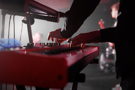 The keyboardist plays his part during the band's live performance